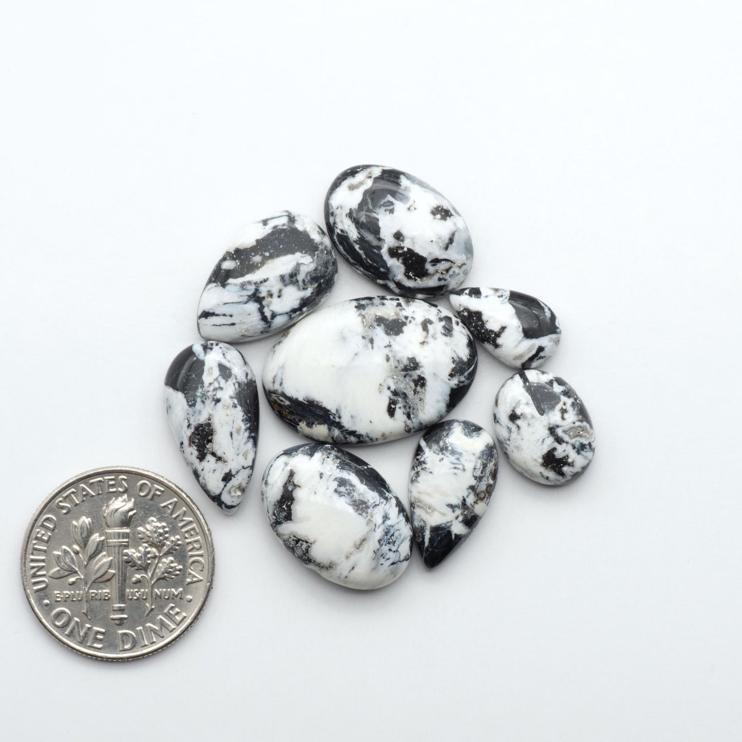 Natural White Buffalo Stone Cabochons are semi-precious gemstones cut into shapes ideal for jewelry-making, making them an excellent choice for artisans.
