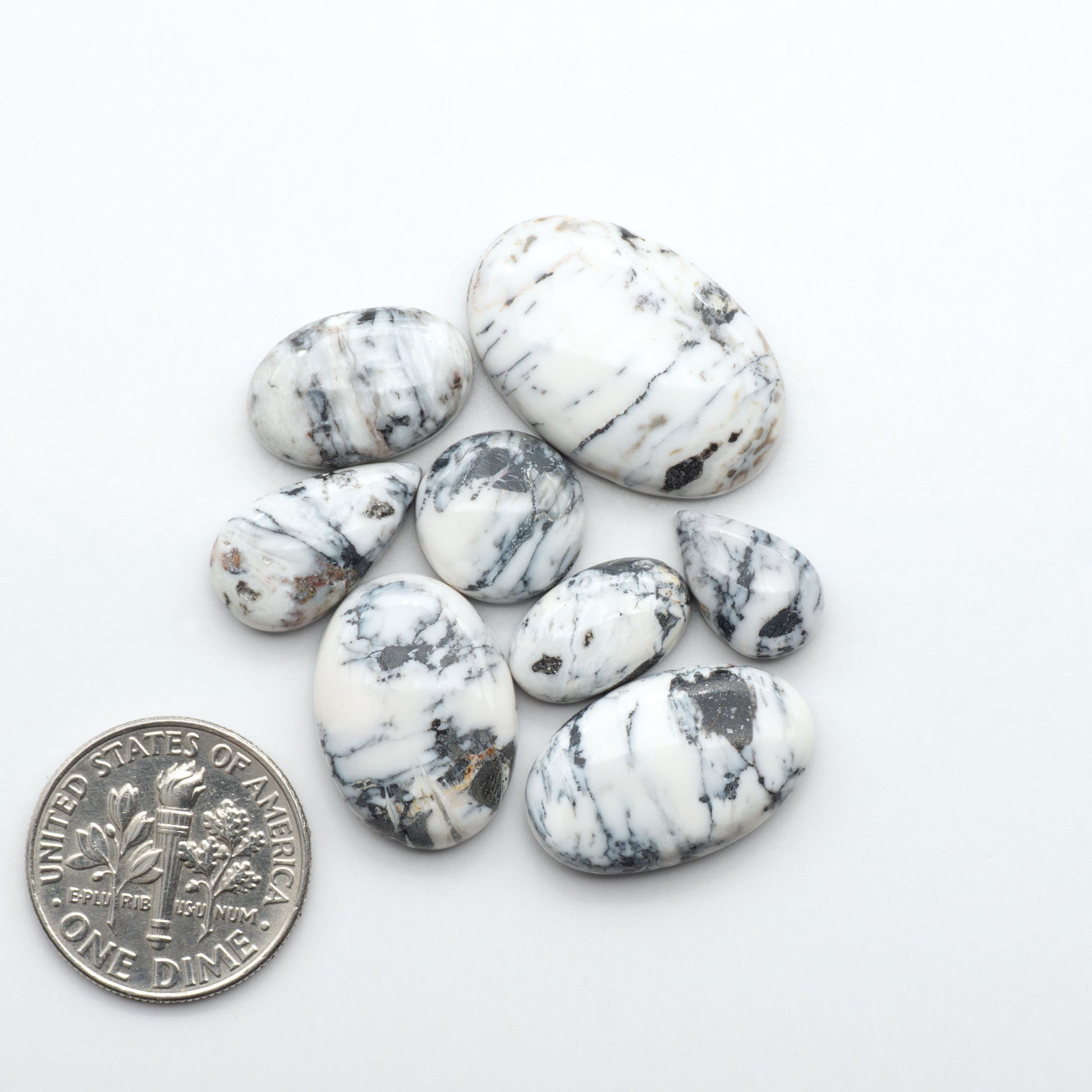 Natural White Buffalo Stone Cabochons are semi-precious gemstones cut into shapes ideal for jewelry-making, making them an excellent choice for artisans.
