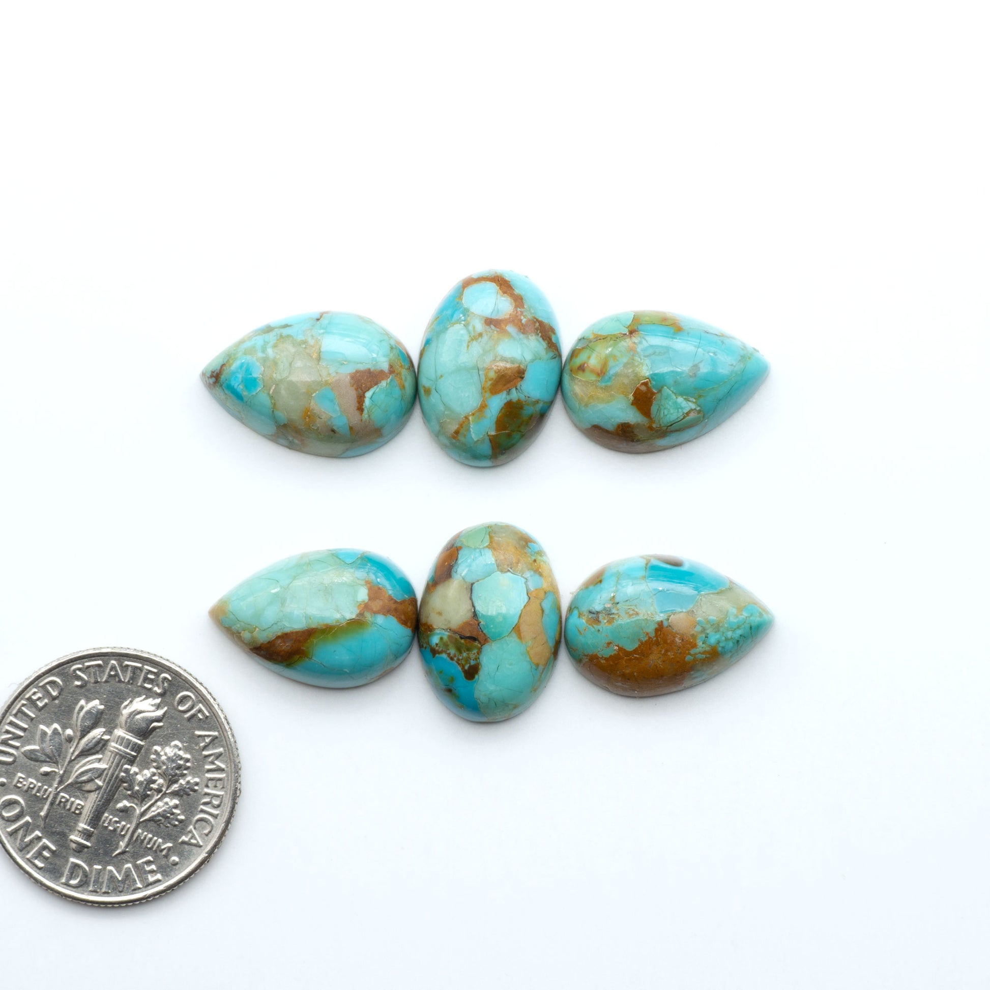 Enhance your jewelry designs with Pressed Turquoise Nugget Cabochons. Crafted from composite materials they add a captivating touch to your creations.