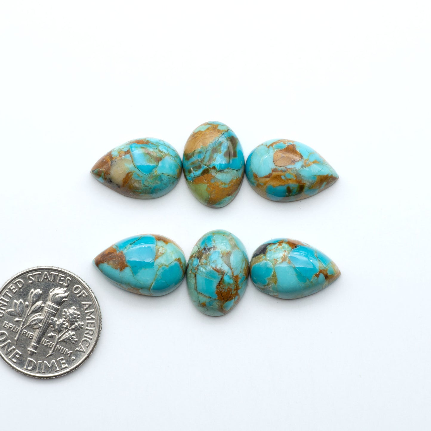 Enhance your jewelry designs with Pressed Turquoise Nugget Cabochons. Crafted from composite materials they add a captivating touch to your creations.