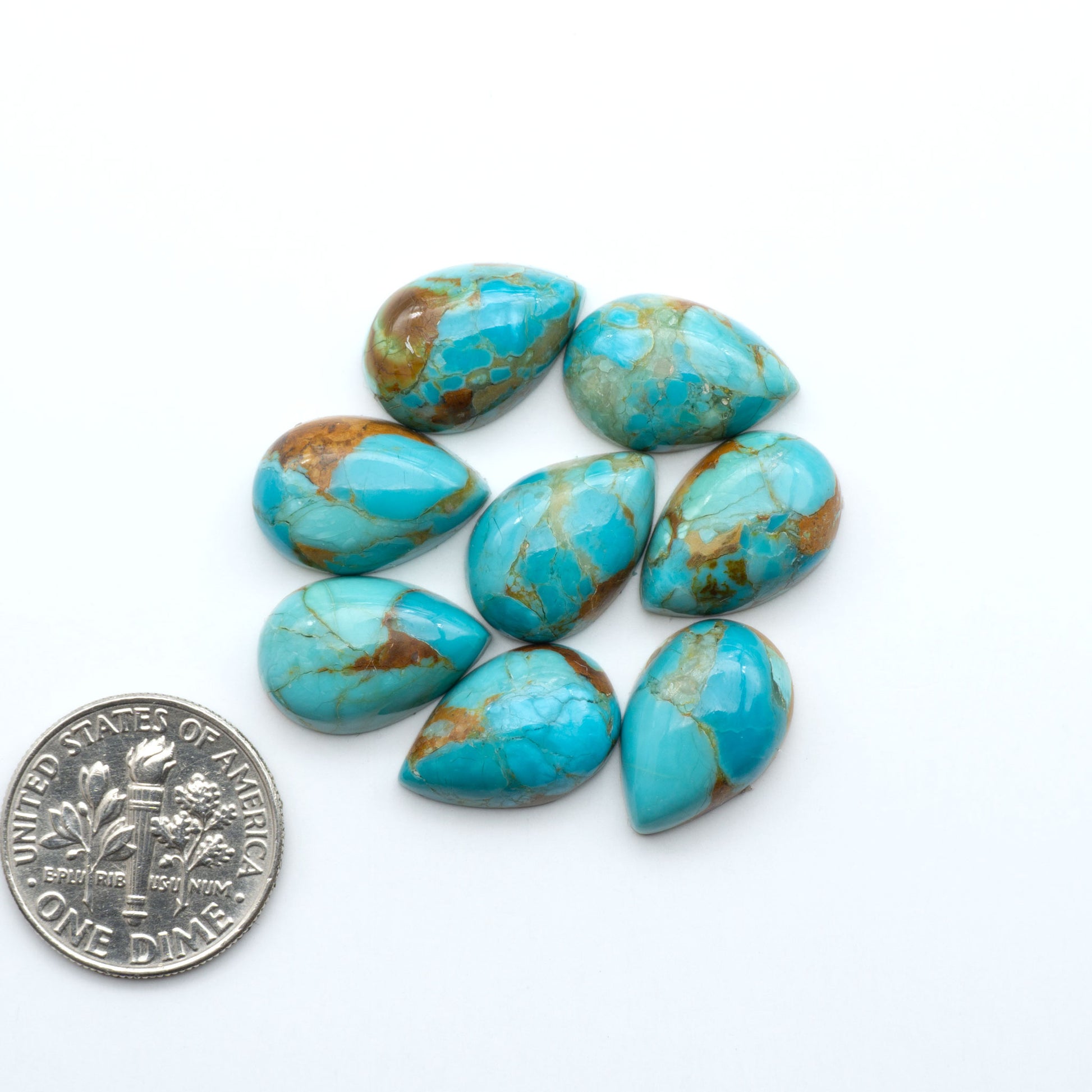 Enhance your jewelry designs with Pressed Turquoise Nugget Cabochons. Crafted from composite materials they add a captivating touch to your creations.