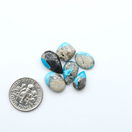 Kingman Turquoise Cabochons are a staple in the jewelry industry, known for their stunning blue-green color. Perfect for necklaces, earrings, and more!