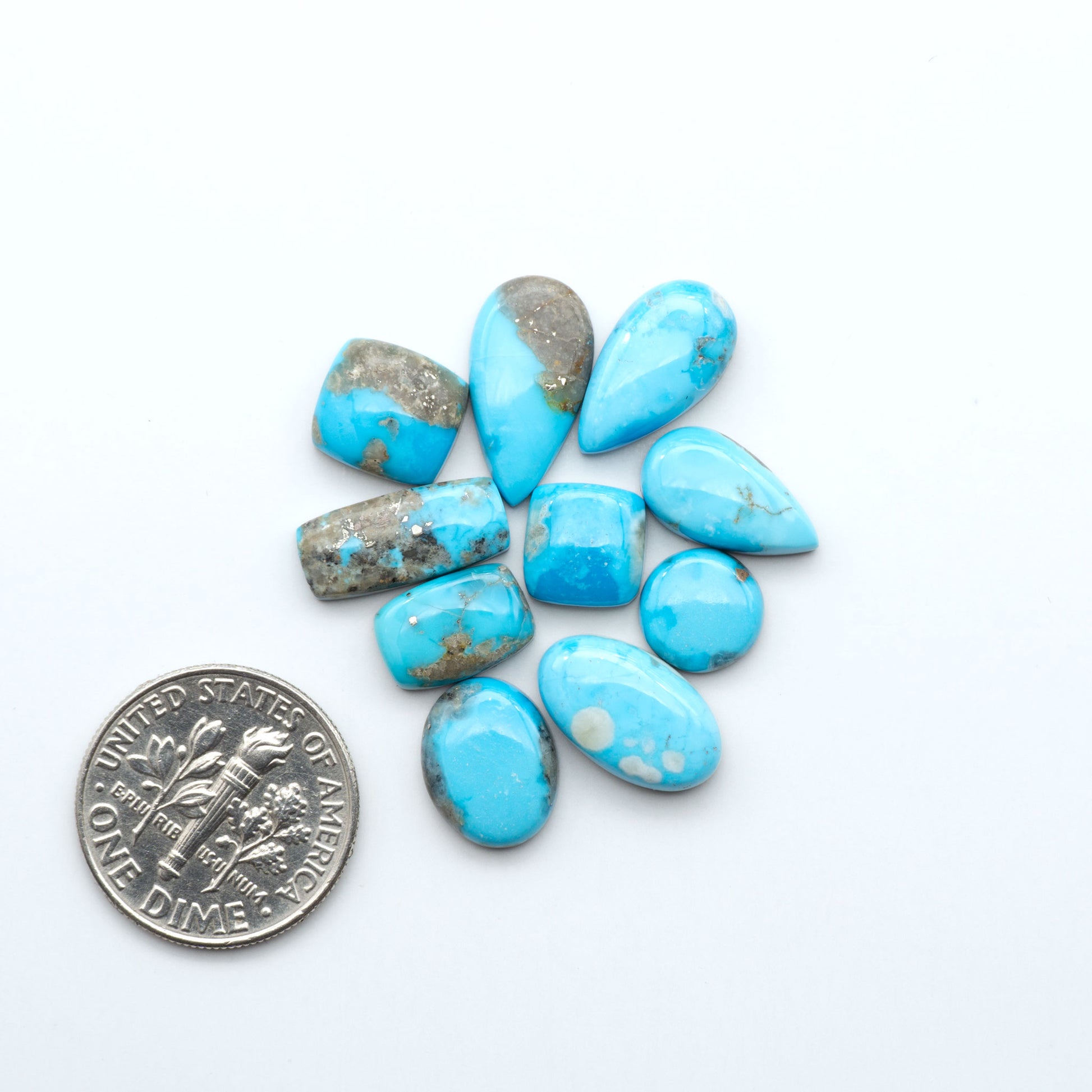 Kingman Turquoise Cabochons are a staple in the jewelry industry, known for their stunning blue-green color. Perfect for necklaces, earrings, and more!