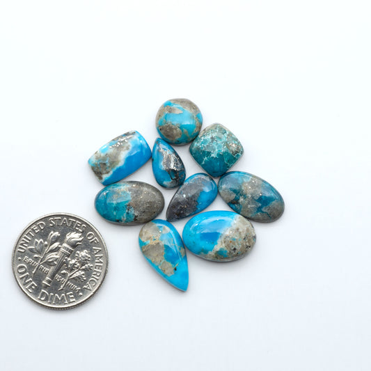 Kingman Turquoise Cabochons are a staple in the jewelry industry, known for their stunning blue-green color. Perfect for necklaces, earrings, and more!
