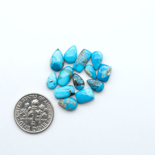 Kingman Turquoise Cabochons are a staple in the jewelry industry, known for their stunning blue-green color. Perfect for necklaces, earrings, and more!