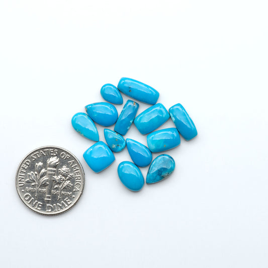 Kingman Turquoise Cabochons are a staple in the jewelry industry, known for their stunning blue-green color. Perfect for necklaces, earrings, and more!