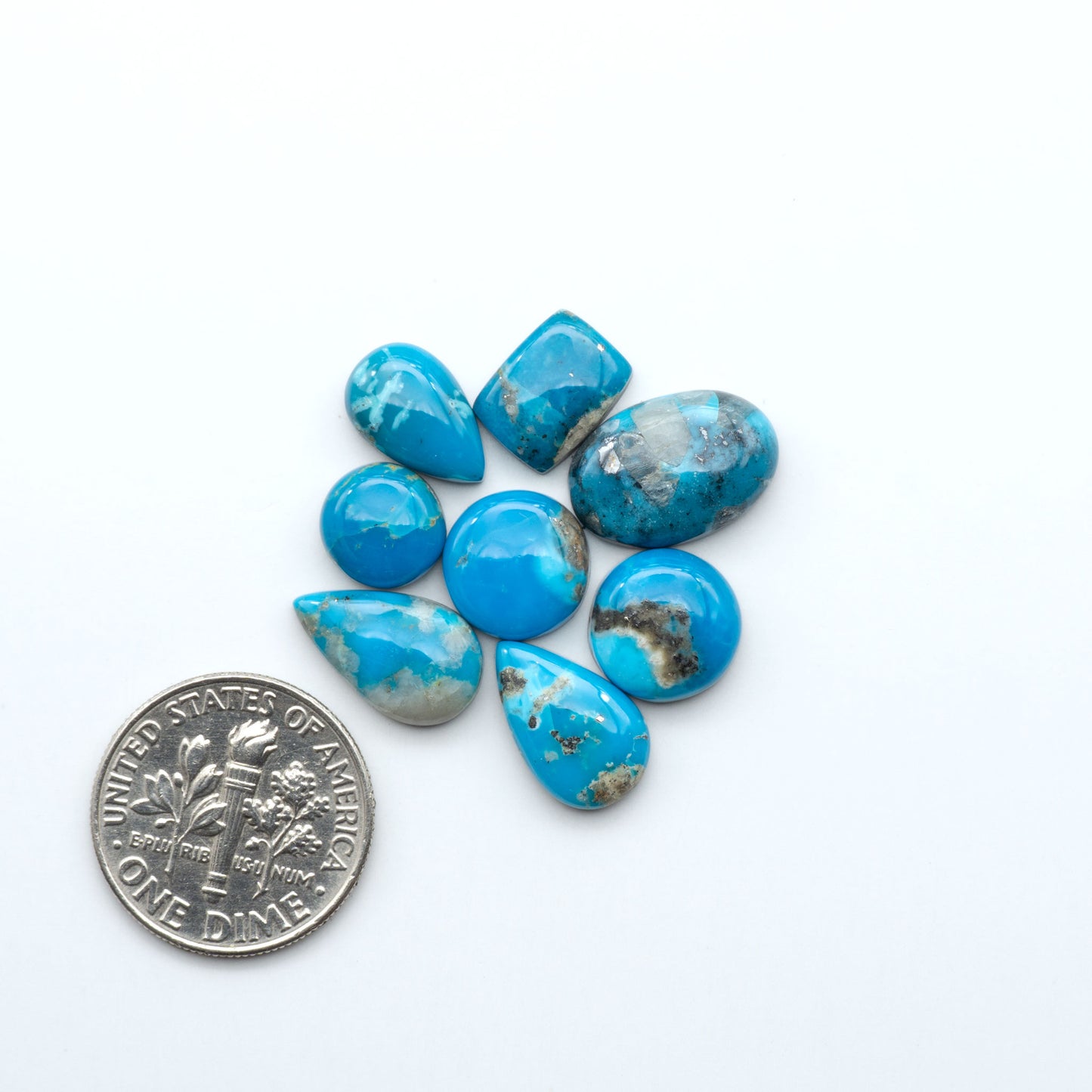 Kingman Turquoise Cabochons are a staple in the jewelry industry, known for their stunning blue-green color. Perfect for necklaces, earrings, and more!