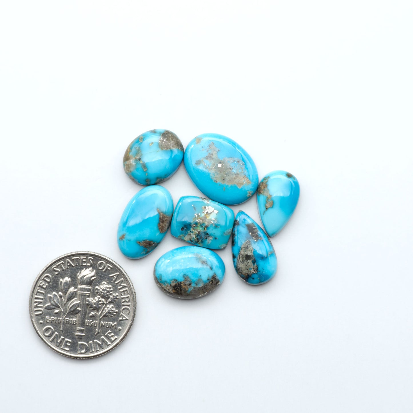 Kingman Turquoise Cabochons are a staple in the jewelry industry, known for their stunning blue-green color. Perfect for necklaces, earrings, and more!