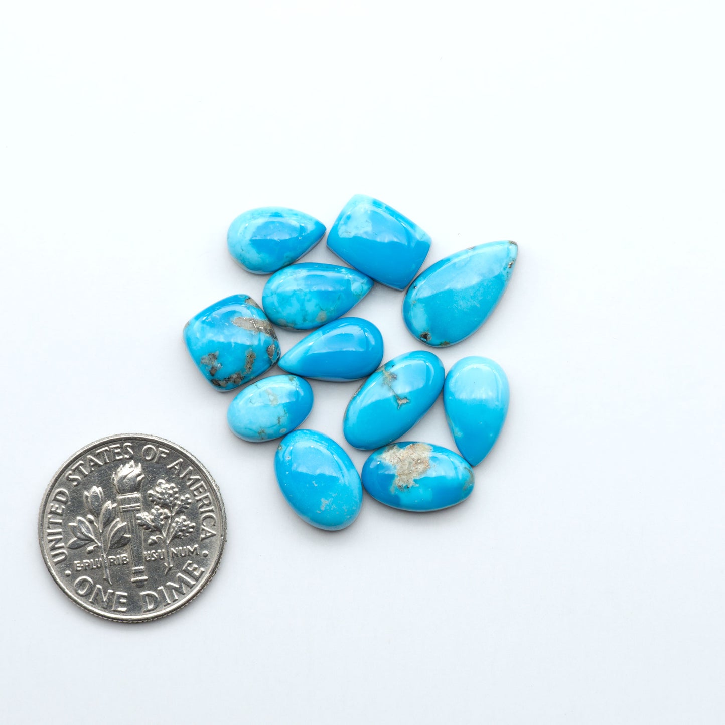 Kingman Turquoise Cabochons are a staple in the jewelry industry, known for their stunning blue-green color. Perfect for necklaces, earrings, and more!