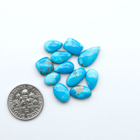 Kingman Turquoise Cabochons are a staple in the jewelry industry, known for their stunning blue-green color. Perfect for necklaces, earrings, and more!