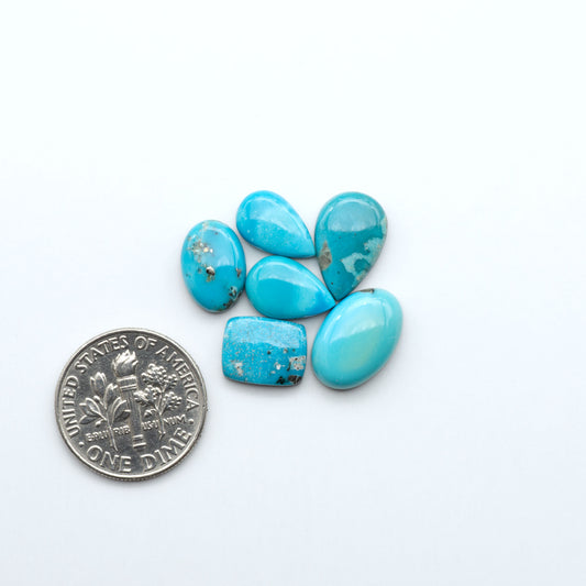 Kingman Turquoise Cabochons are a staple in the jewelry industry, known for their stunning blue-green color. Perfect for necklaces, earrings, and more!