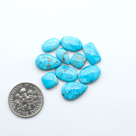 Kingman Turquoise Cabochons are a staple in the jewelry industry, known for their stunning blue-green color. Perfect for necklaces, earrings, and more!