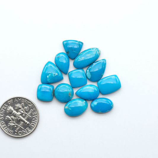 Kingman Turquoise Cabochons are a staple in the jewelry industry, known for their stunning blue-green color. Perfect for necklaces, earrings, and more!