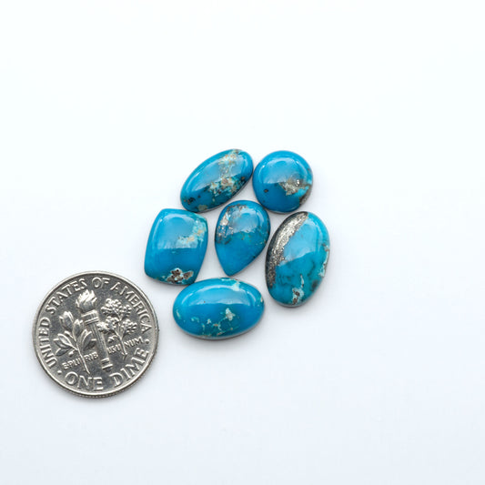 Kingman Turquoise Cabochons are a staple in the jewelry industry, known for their stunning blue-green color. Perfect for necklaces, earrings, and more!