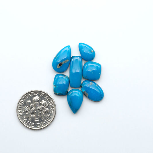 Kingman Turquoise Cabochons are a staple in the jewelry industry, known for their stunning blue-green color. Perfect for necklaces, earrings, and more!