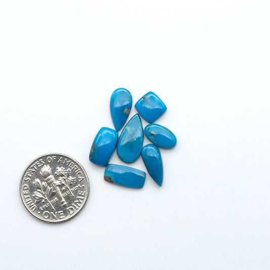 Kingman Turquoise Cabochons are a staple in the jewelry industry, known for their stunning blue-green color. Perfect for necklaces, earrings, and more!