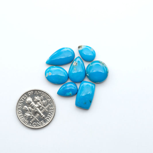 Kingman Turquoise Cabochons are a staple in the jewelry industry, known for their stunning blue-green color. Perfect for necklaces, earrings, and more!