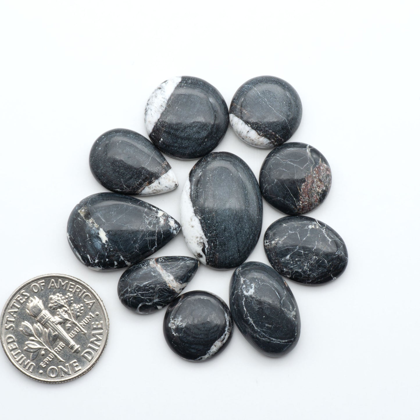 Natural White Buffalo Stone Cabochons are semi-precious gemstones cut into shapes ideal for jewelry-making, making them an excellent choice for artisans.