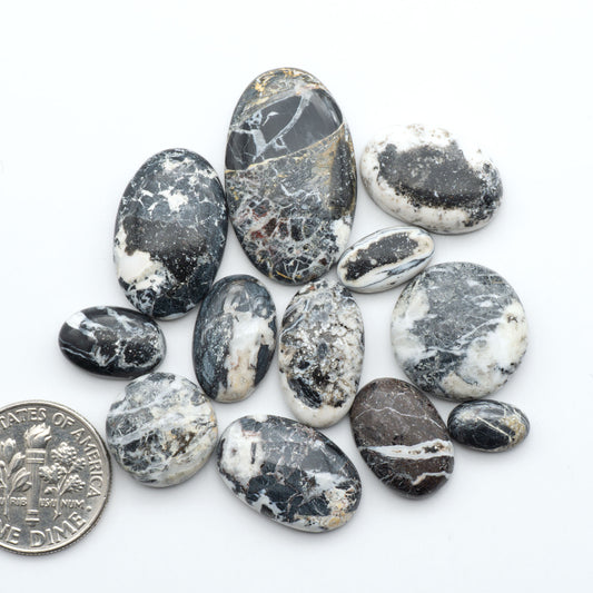 Natural White Buffalo Stone Cabochons are semi-precious gemstones cut into shapes ideal for jewelry-making, making them an excellent choice for artisans.
