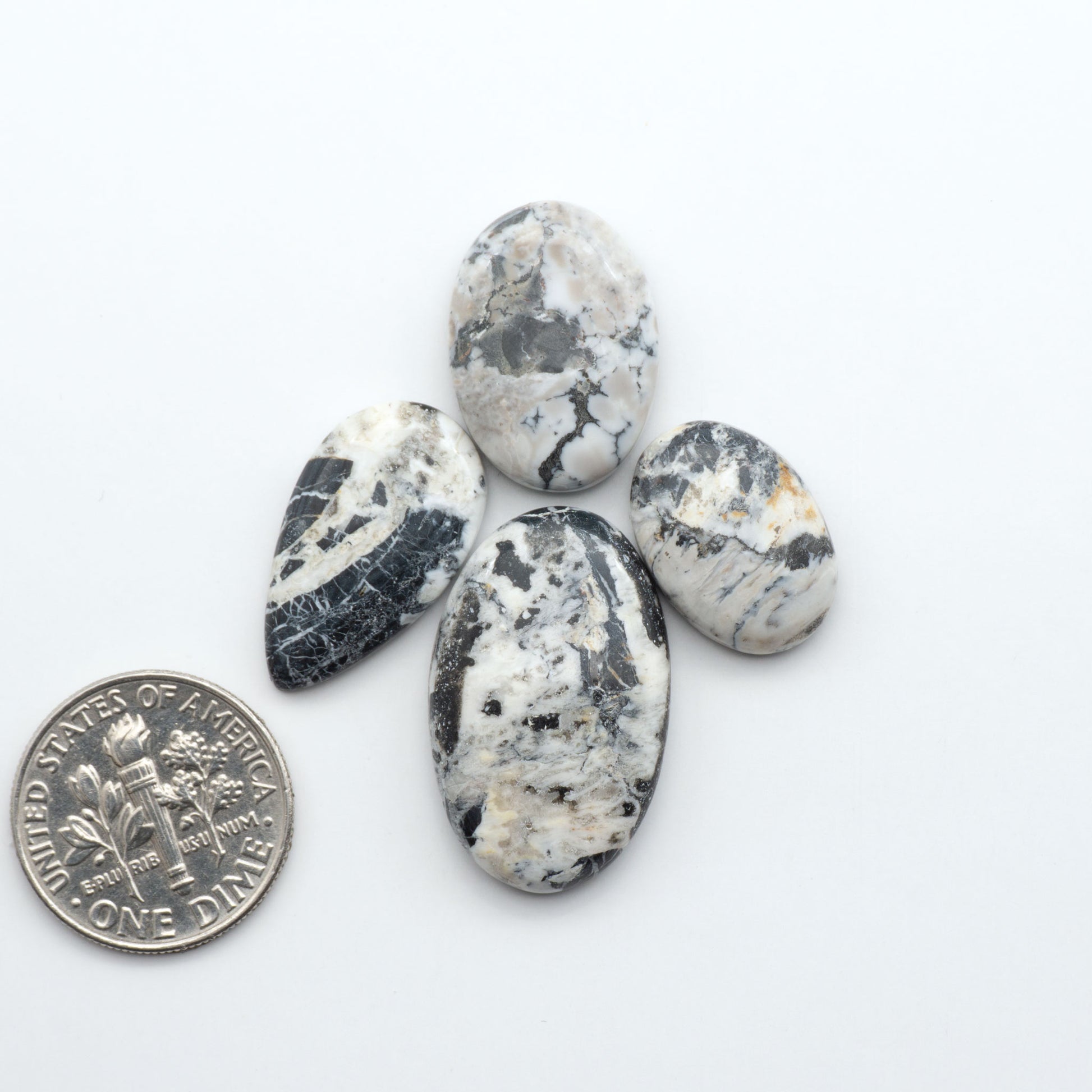Natural White Buffalo Stone Cabochons are semi-precious gemstones cut into shapes ideal for jewelry-making, making them an excellent choice for artisans.