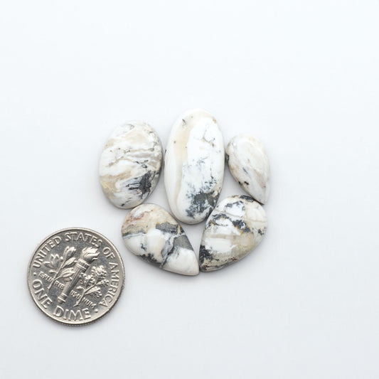 Natural White Buffalo Stone Cabochons are semi-precious gemstones cut into shapes ideal for jewelry-making, making them an excellent choice for artisans.