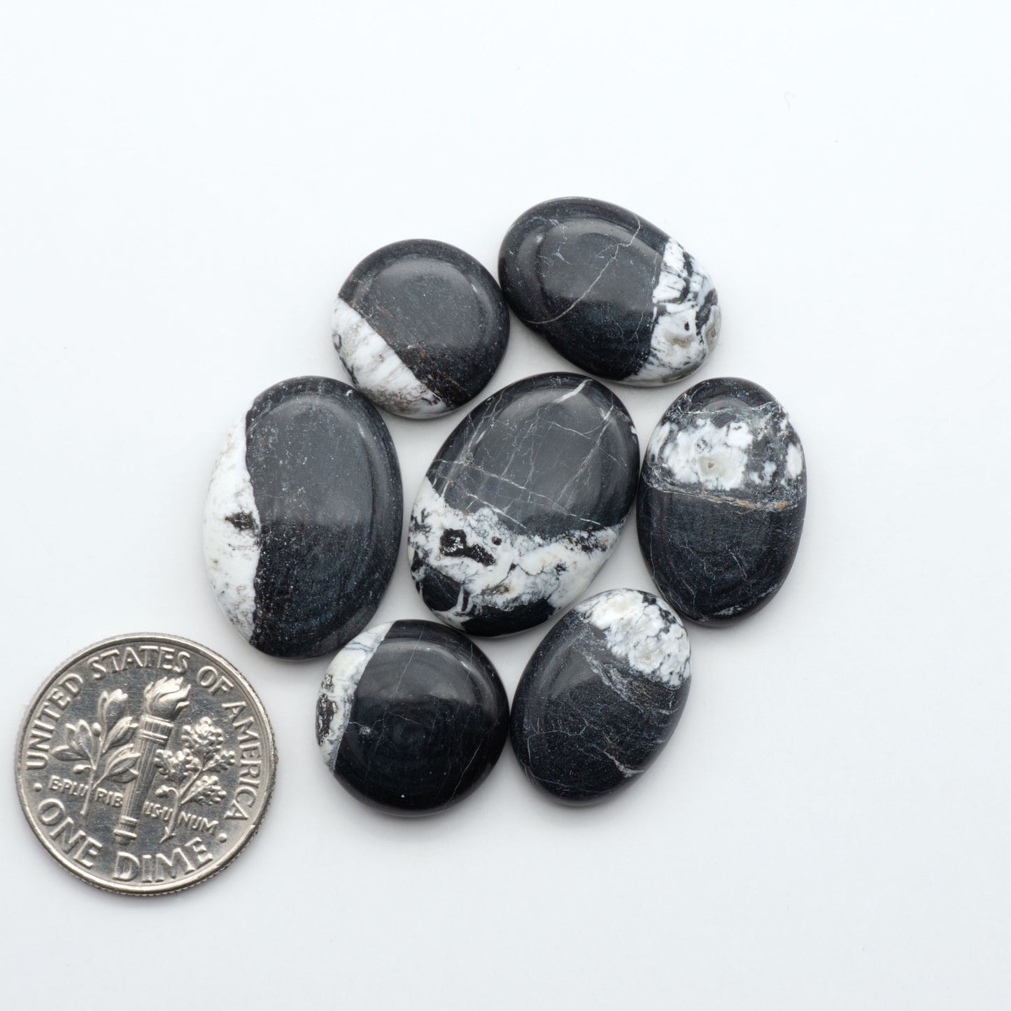 Natural White Buffalo Stone Cabochons are semi-precious gemstones cut into shapes ideal for jewelry-making, making them an excellent choice for artisans.