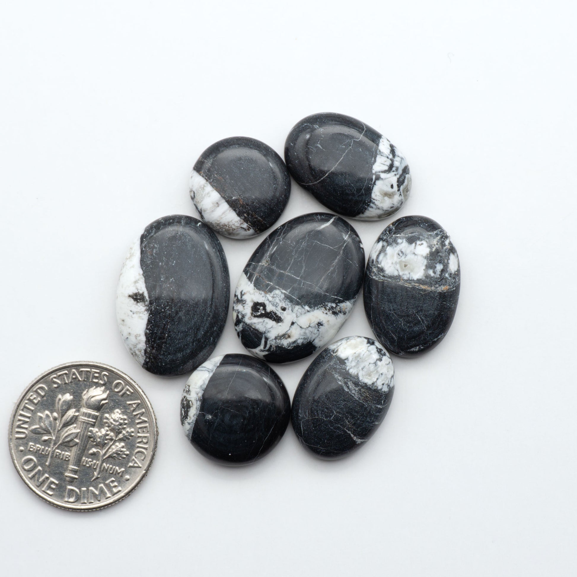 Natural White Buffalo Stone Cabochons are semi-precious gemstones cut into shapes ideal for jewelry-making, making them an excellent choice for artisans.