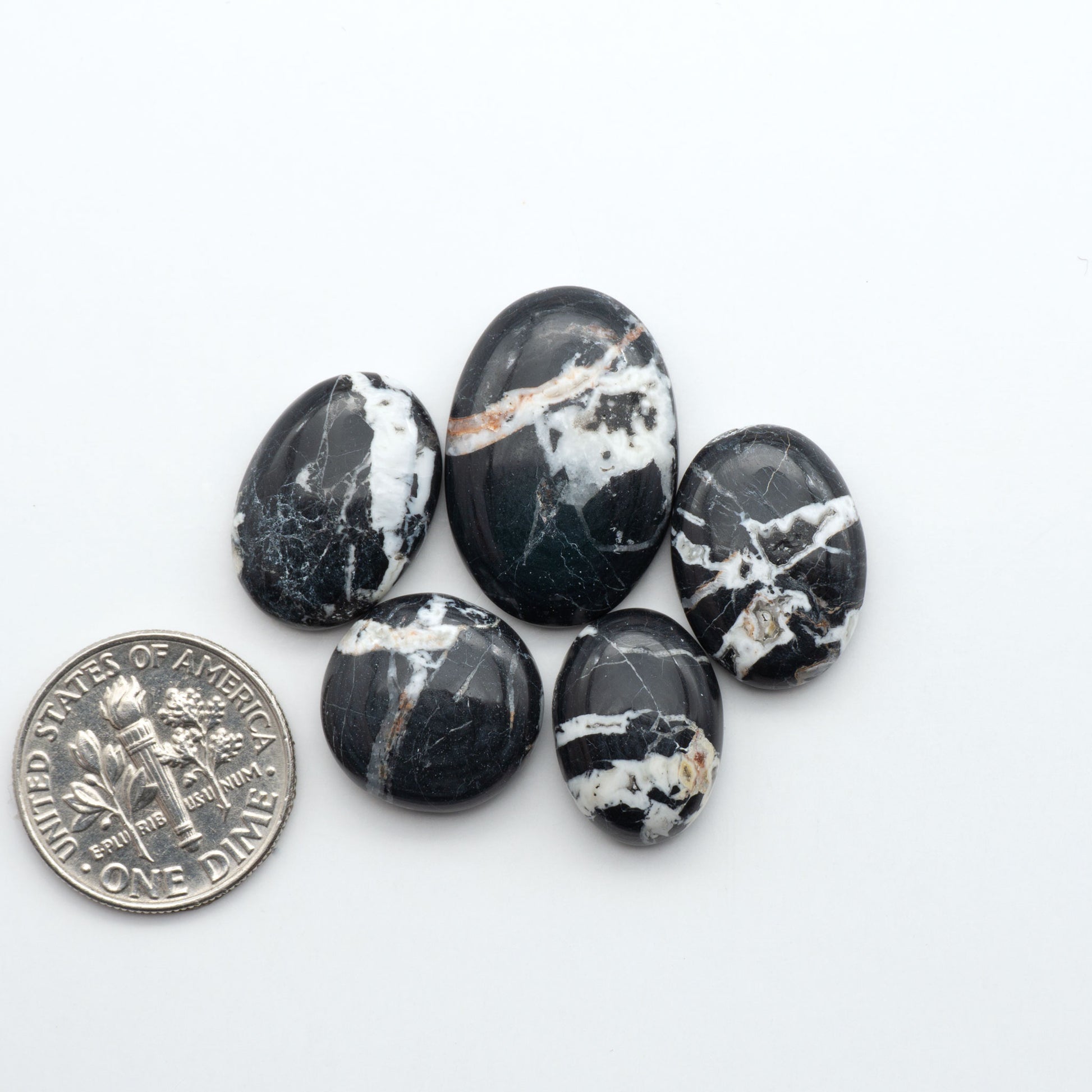 Natural White Buffalo Stone Cabochons are semi-precious gemstones cut into shapes ideal for jewelry-making, making them an excellent choice for artisans.