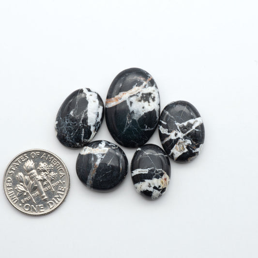 Natural White Buffalo Stone Cabochons are semi-precious gemstones cut into shapes ideal for jewelry-making, making them an excellent choice for artisans.