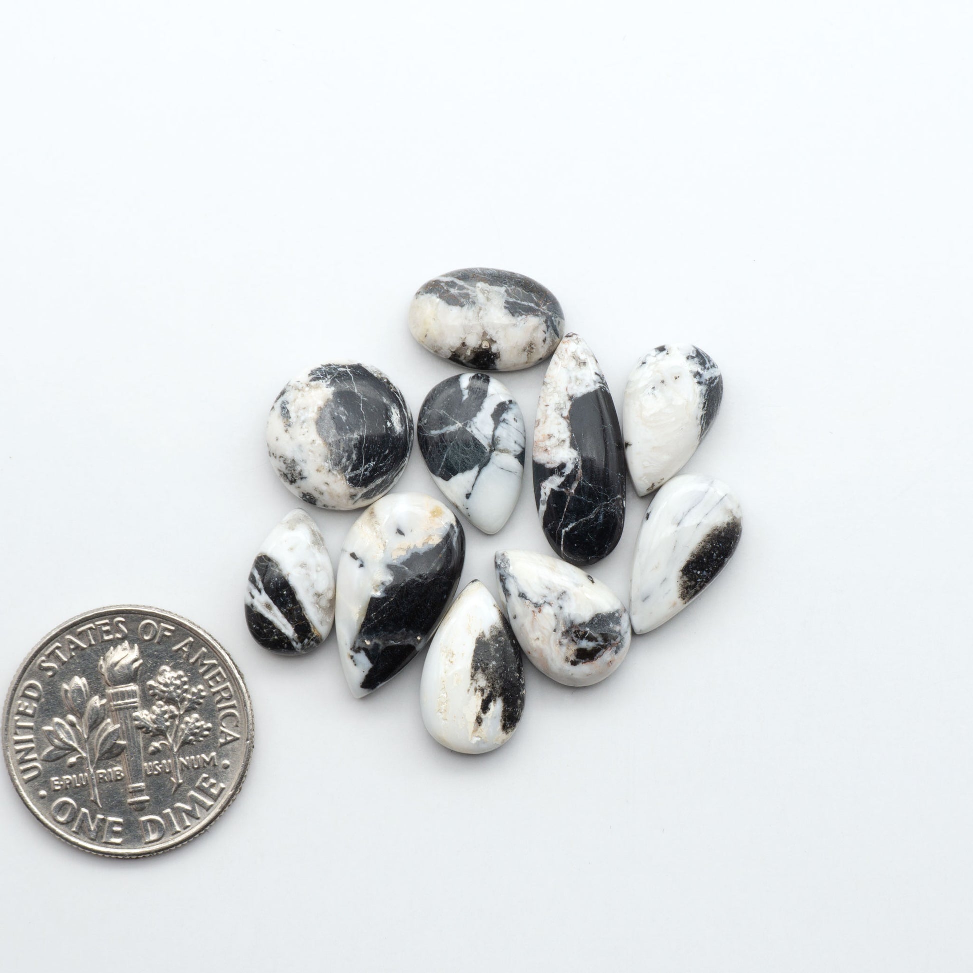 Natural White Buffalo Stone Cabochons are semi-precious gemstones cut into shapes ideal for jewelry-making, making them an excellent choice for artisans.