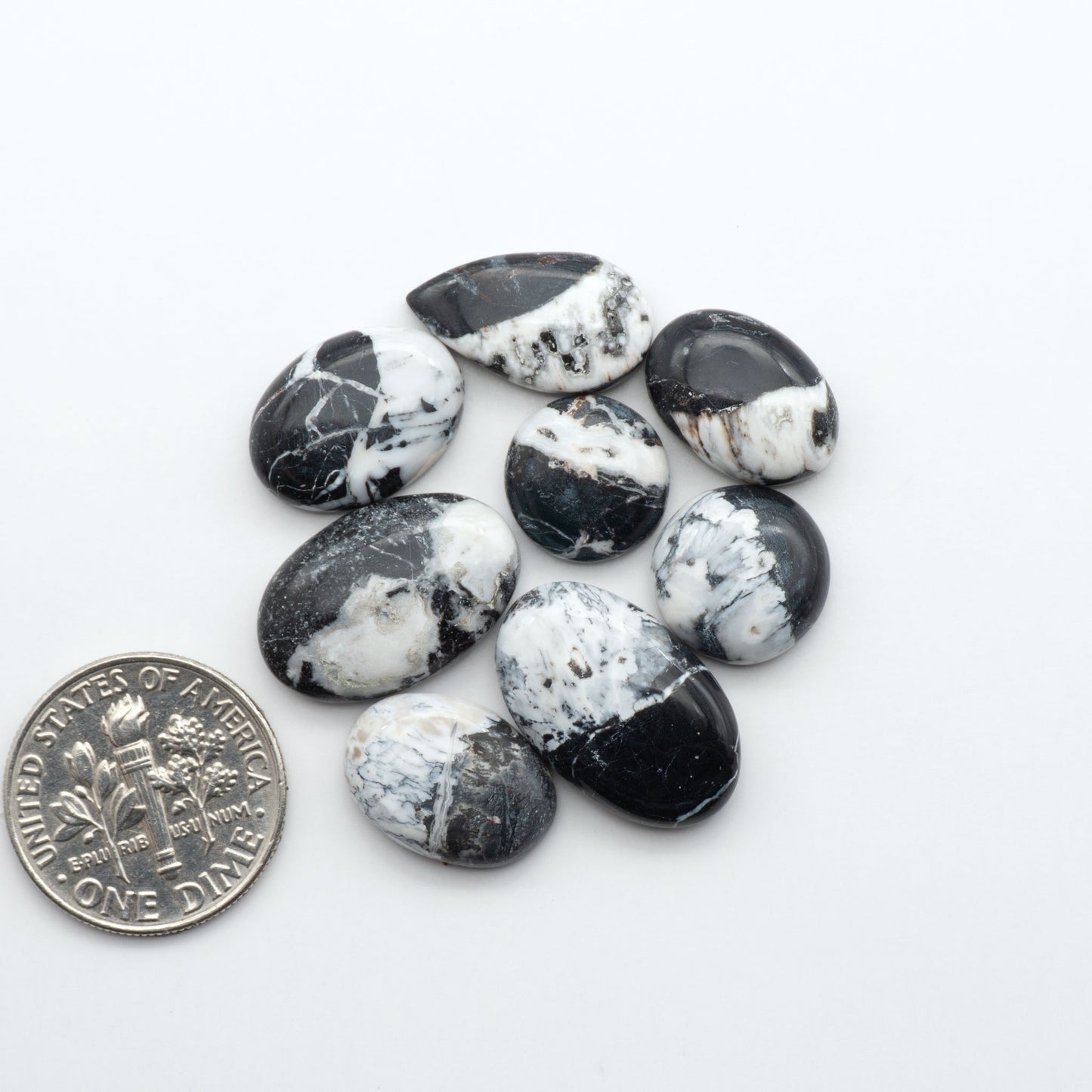 Natural White Buffalo Stone Cabochons are semi-precious gemstones cut into shapes ideal for jewelry-making, making them an excellent choice for artisans.