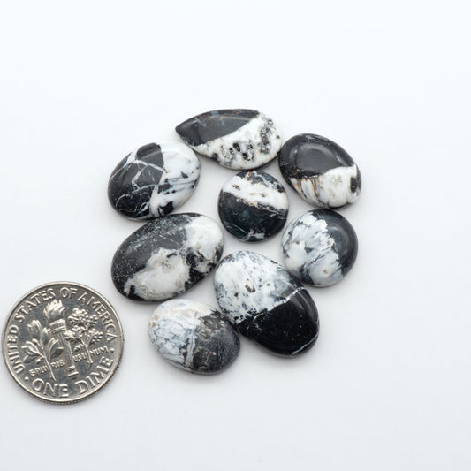 Natural White Buffalo Stone Cabochons are semi-precious gemstones cut into shapes ideal for jewelry-making, making them an excellent choice for artisans.