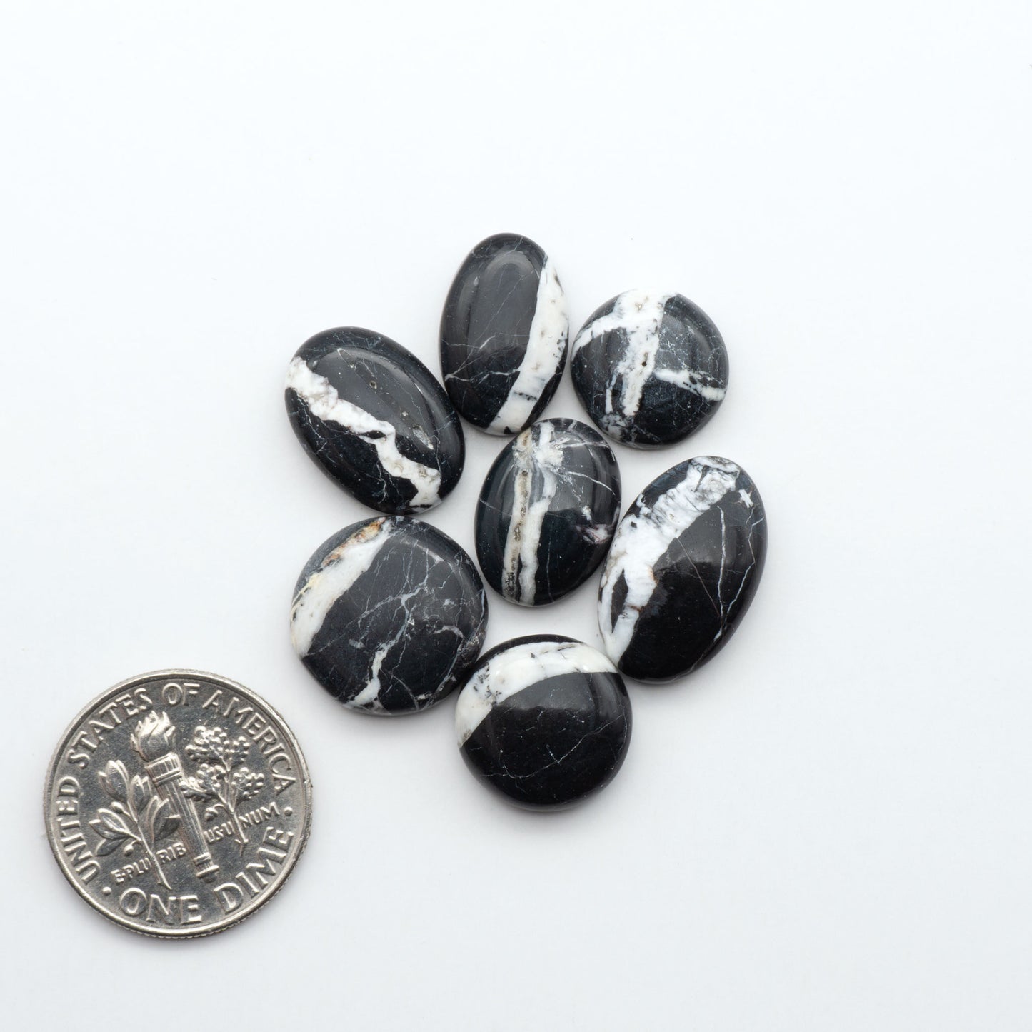 Natural White Buffalo Stone Cabochons are semi-precious gemstones cut into shapes ideal for jewelry-making, making them an excellent choice for artisans.