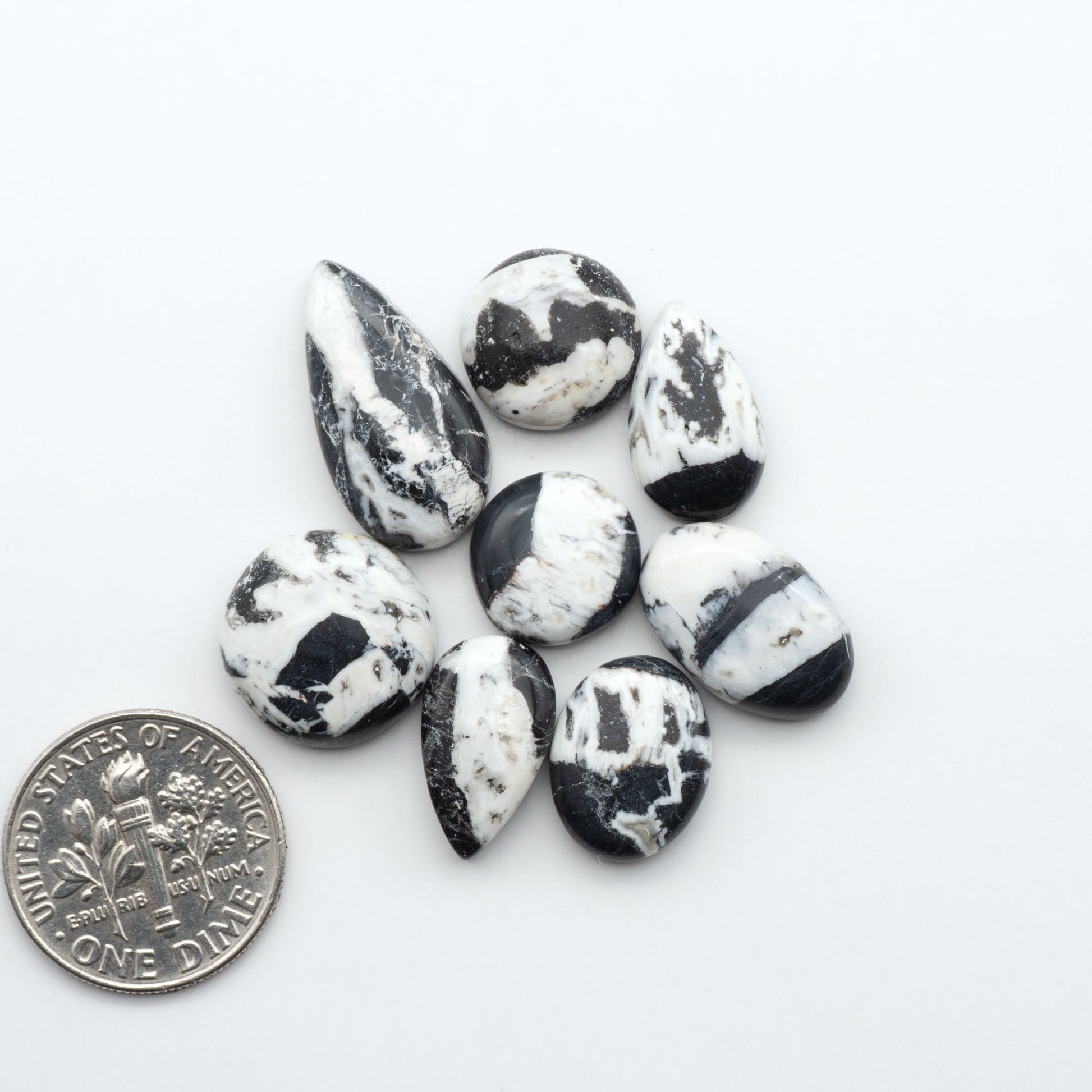 Natural White Buffalo Stone Cabochons are semi-precious gemstones cut into shapes ideal for jewelry-making, making them an excellent choice for artisans.