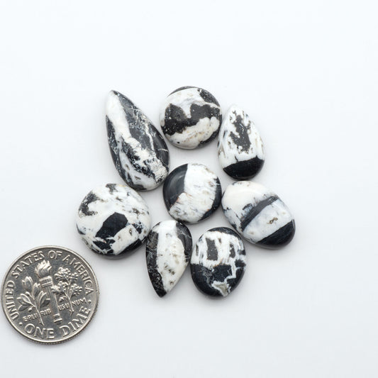 Natural White Buffalo Stone Cabochons are semi-precious gemstones cut into shapes ideal for jewelry-making, making them an excellent choice for artisans.