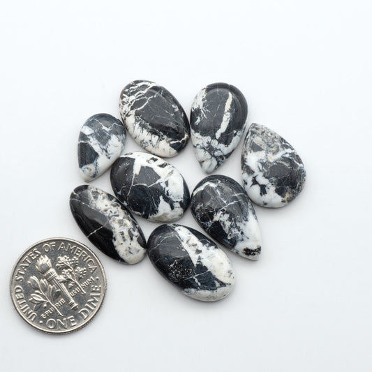 Natural White Buffalo Stone Cabochons are semi-precious gemstones cut into shapes ideal for jewelry-making, making them an excellent choice for artisans.