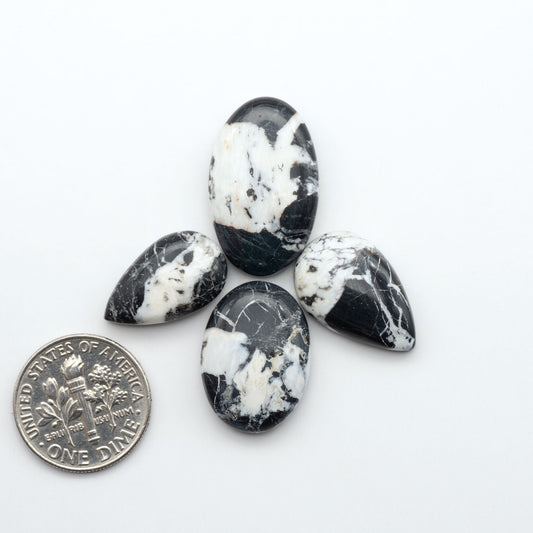 Natural White Buffalo Stone Cabochons are semi-precious gemstones cut into shapes ideal for jewelry-making, making them an excellent choice for artisans.
