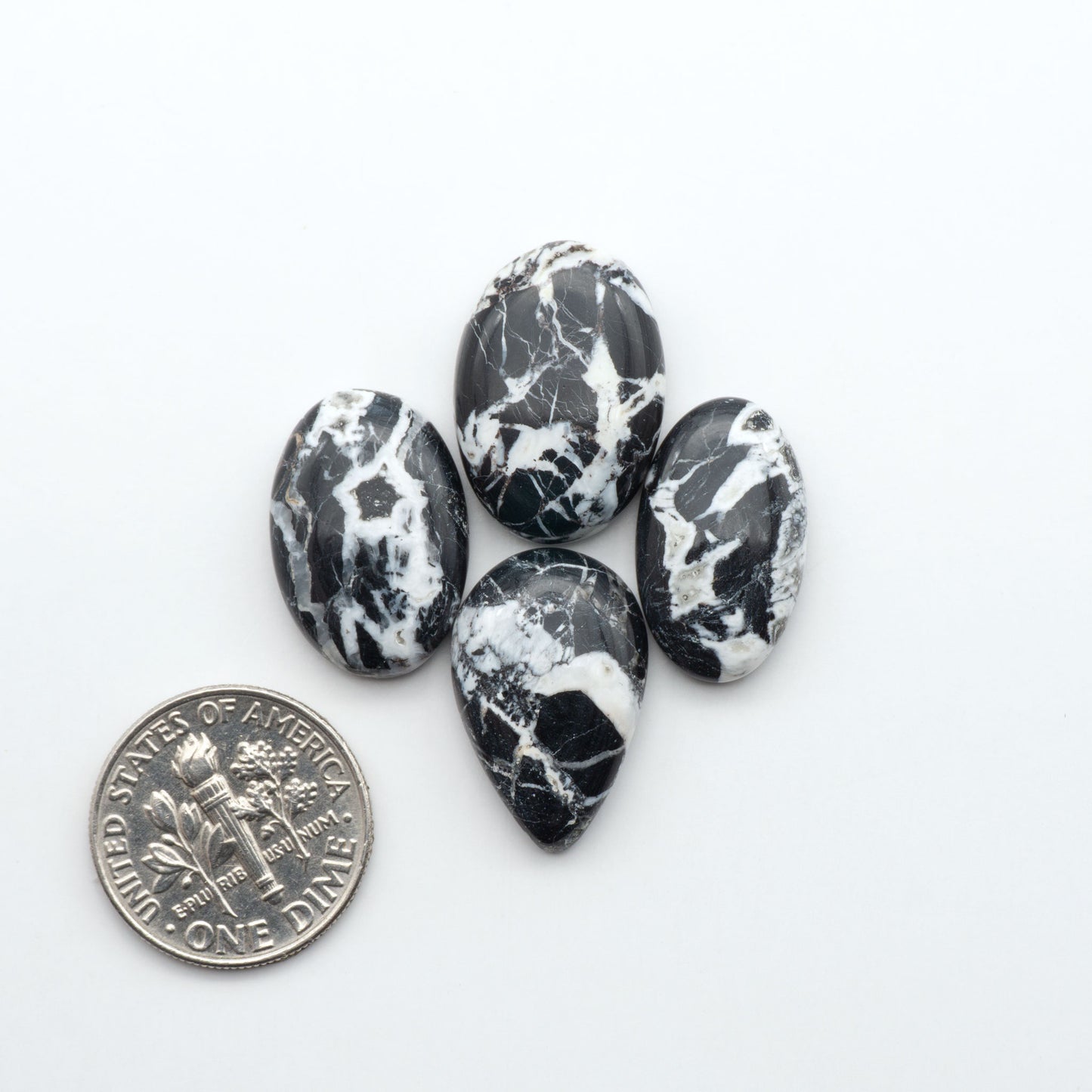Natural White Buffalo Stone Cabochons are semi-precious gemstones cut into shapes ideal for jewelry-making, making them an excellent choice for artisans.