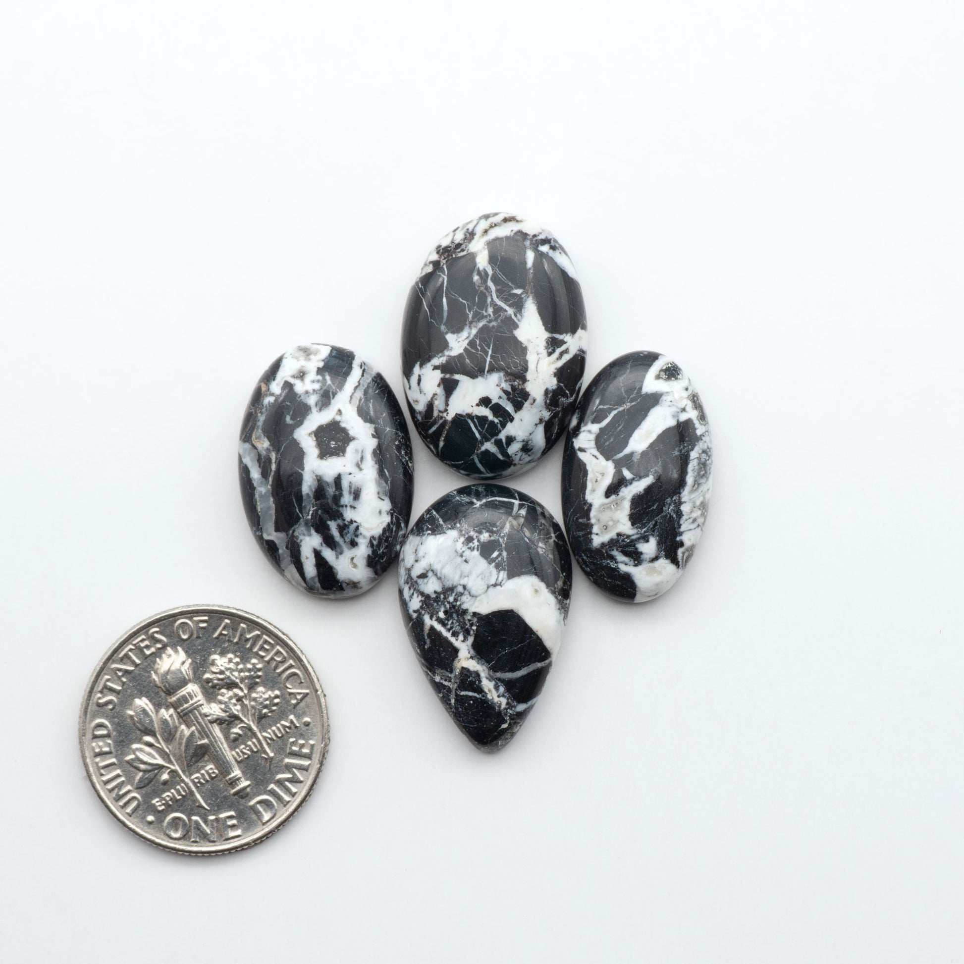 Natural White Buffalo Stone Cabochons are semi-precious gemstones cut into shapes ideal for jewelry-making, making them an excellent choice for artisans.