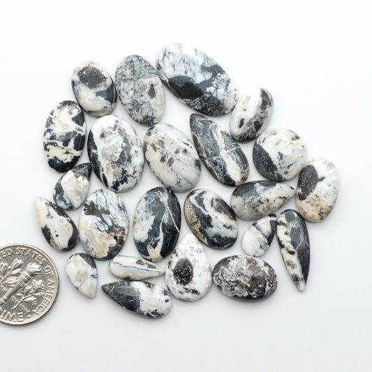 Natural White Buffalo Stone Cabochons are semi-precious gemstones cut into shapes ideal for jewelry-making, making them an excellent choice for artisans.