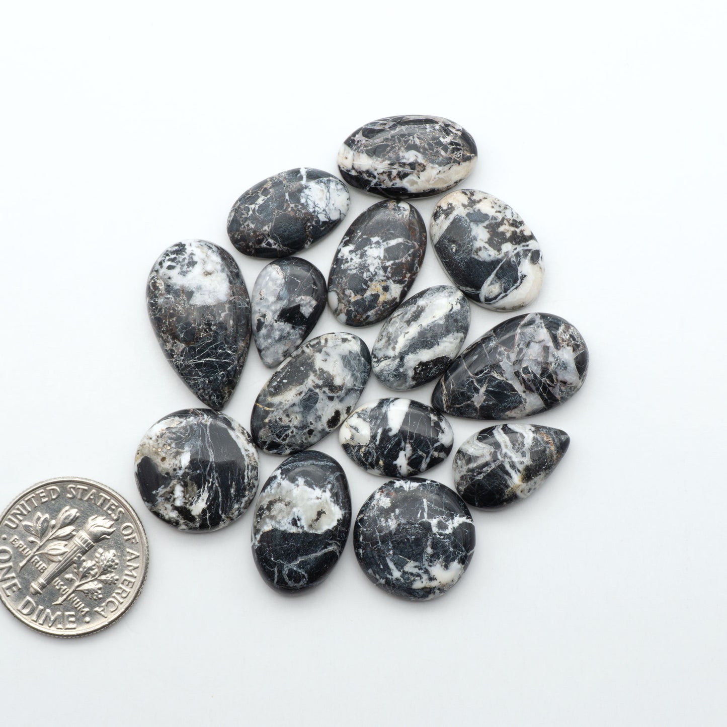 Natural White Buffalo Stone Cabochons are semi-precious gemstones cut into shapes ideal for jewelry-making, making them an excellent choice for artisans.