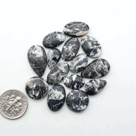 Natural White Buffalo Stone Cabochons are semi-precious gemstones cut into shapes ideal for jewelry-making, making them an excellent choice for artisans.