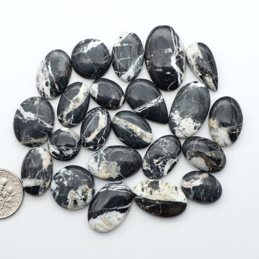 Natural White Buffalo Stone Cabochons are semi-precious gemstones cut into shapes ideal for jewelry-making, making them an excellent choice for artisans.