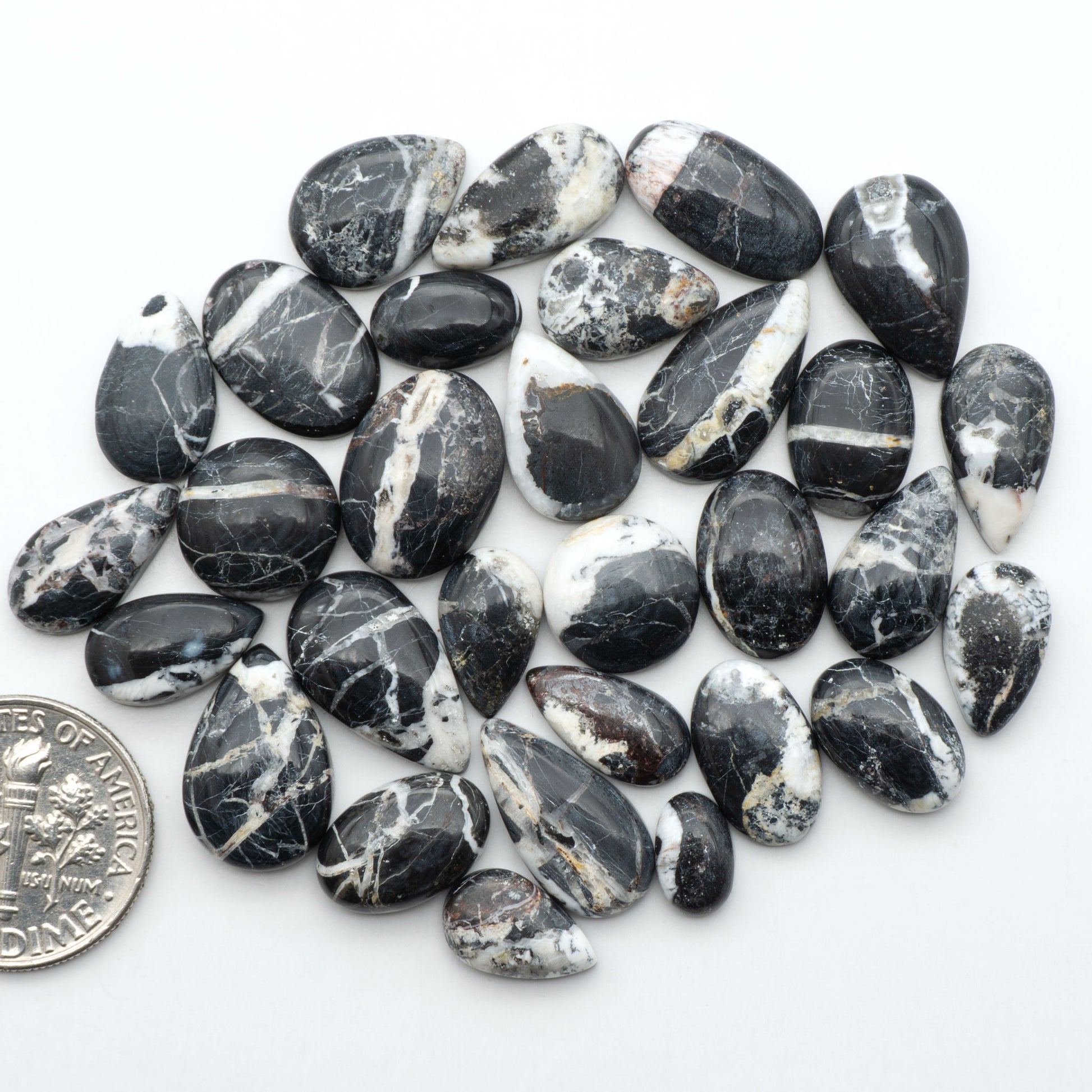 Natural White Buffalo Stone Cabochons are semi-precious gemstones cut into shapes ideal for jewelry-making, making them an excellent choice for artisans.