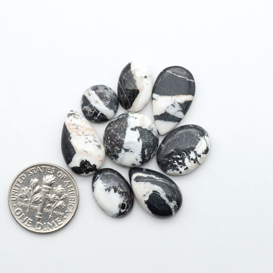 Natural White Buffalo Stone Cabochons are semi-precious gemstones cut into shapes ideal for jewelry-making, making them an excellent choice for artisans.