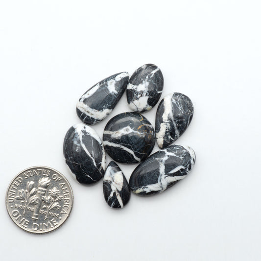 Natural White Buffalo Stone Cabochons are semi-precious gemstones cut into shapes ideal for jewelry-making, making them an excellent choice for artisans.