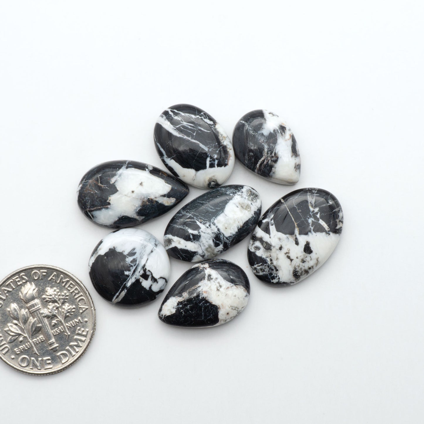 Natural White Buffalo Stone Cabochons are semi-precious gemstones cut into shapes ideal for jewelry-making, making them an excellent choice for artisans.