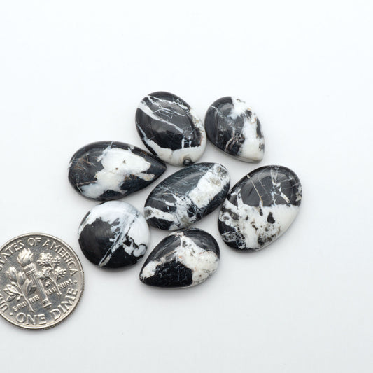 Natural White Buffalo Stone Cabochons are semi-precious gemstones cut into shapes ideal for jewelry-making, making them an excellent choice for artisans.