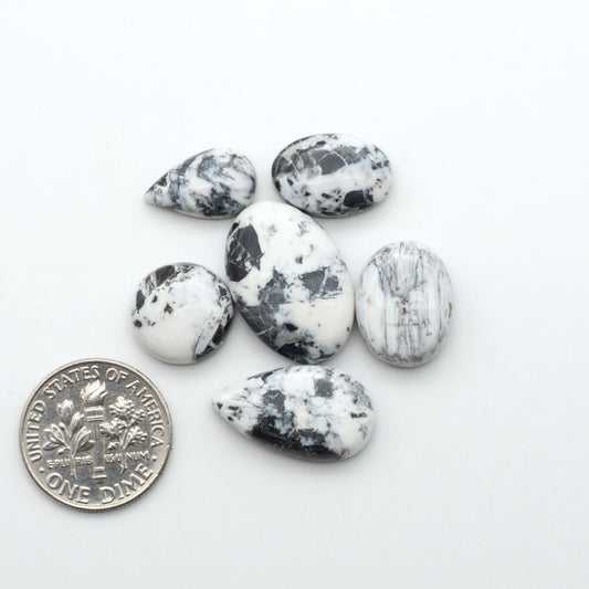 Natural White Buffalo Stone Cabochons are semi-precious gemstones cut into shapes ideal for jewelry-making, making them an excellent choice for artisans.