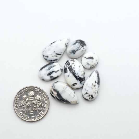 Natural White Buffalo Stone Cabochons are semi-precious gemstones cut into shapes ideal for jewelry-making, making them an excellent choice for artisans.